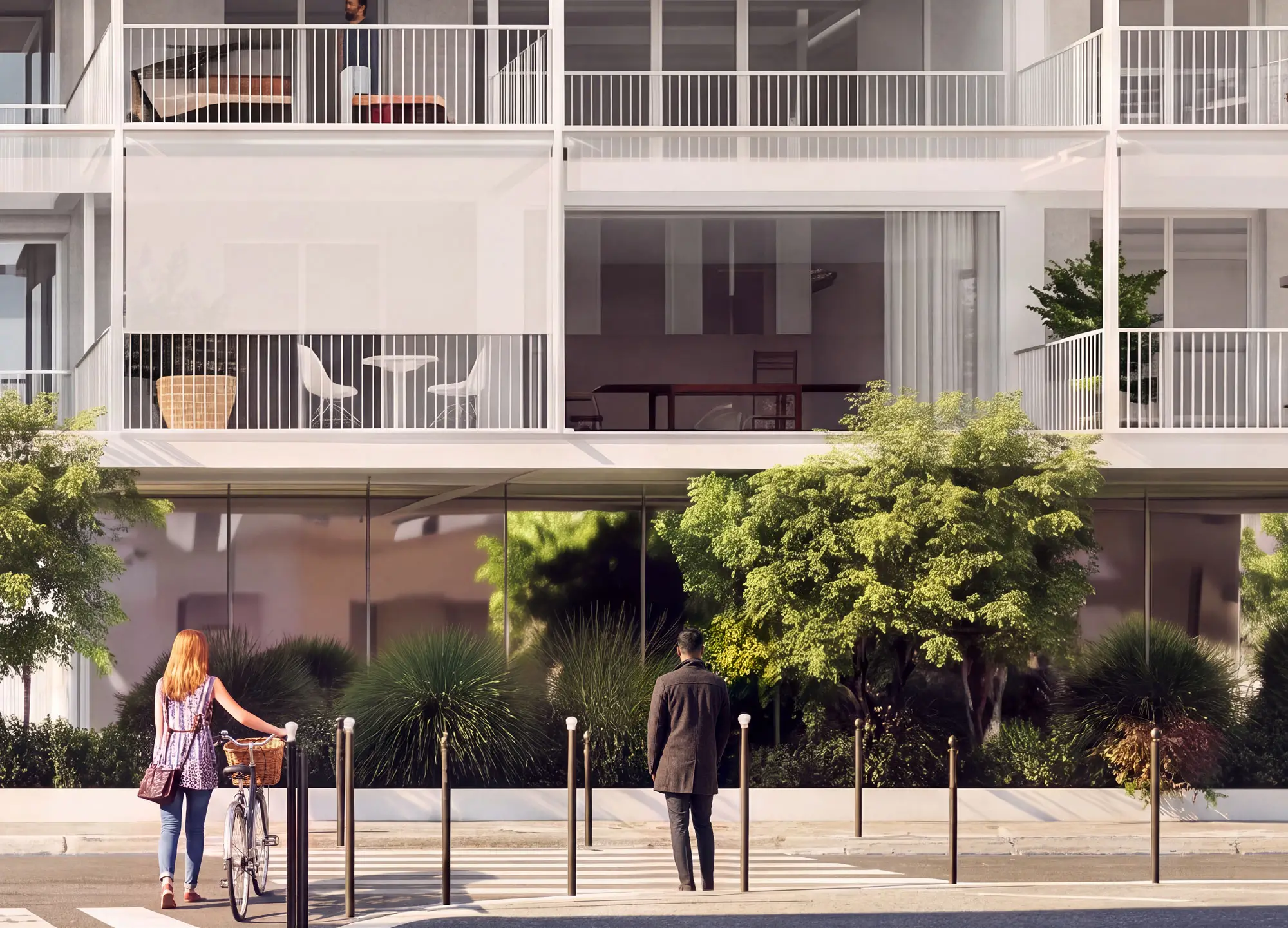 Façade contemporaine d'un immeuble résidentiel avec terrasses aménagées, grandes baies vitrées et végétation luxuriante en pied de bâtiment