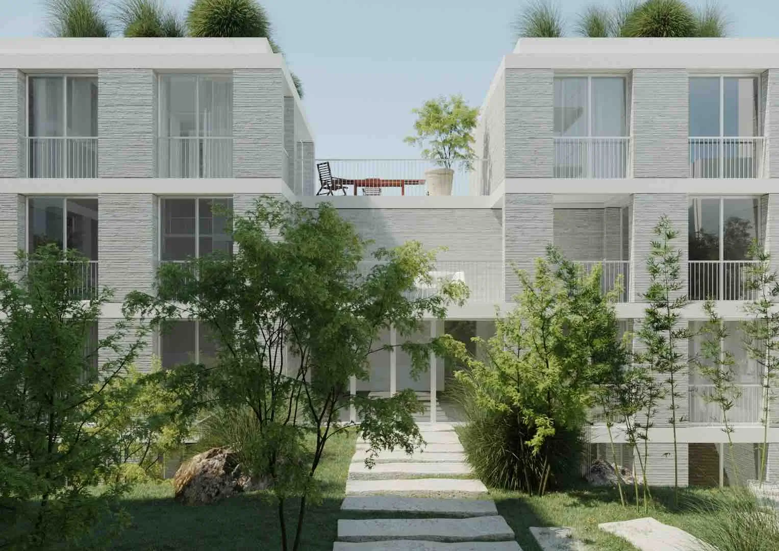 Façade en pierre claire d'une résidence moderne encadrée par des arbres et arbustes verts, avec terrasse sur le toit aménagée